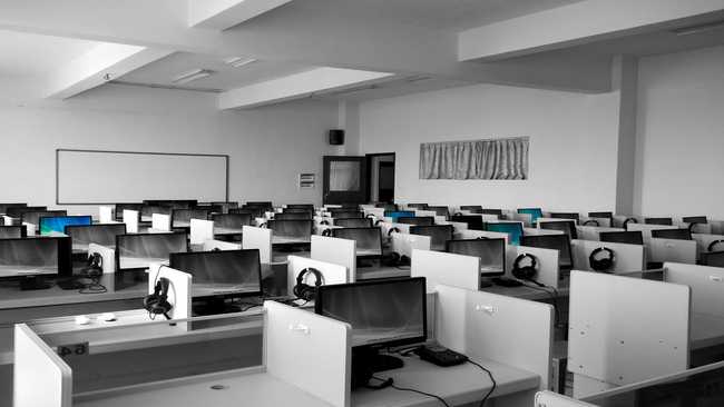 Rows of desks with computers