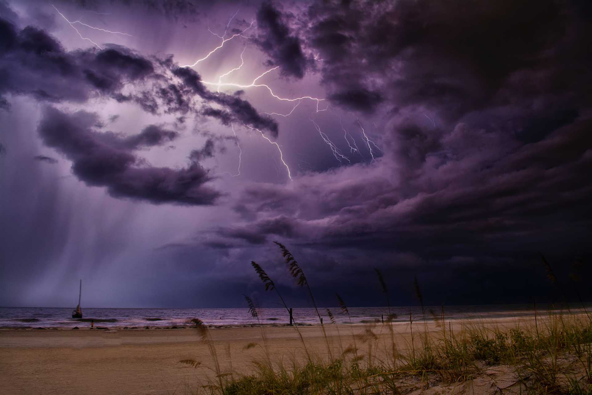Seashore with angry clouds and lightning