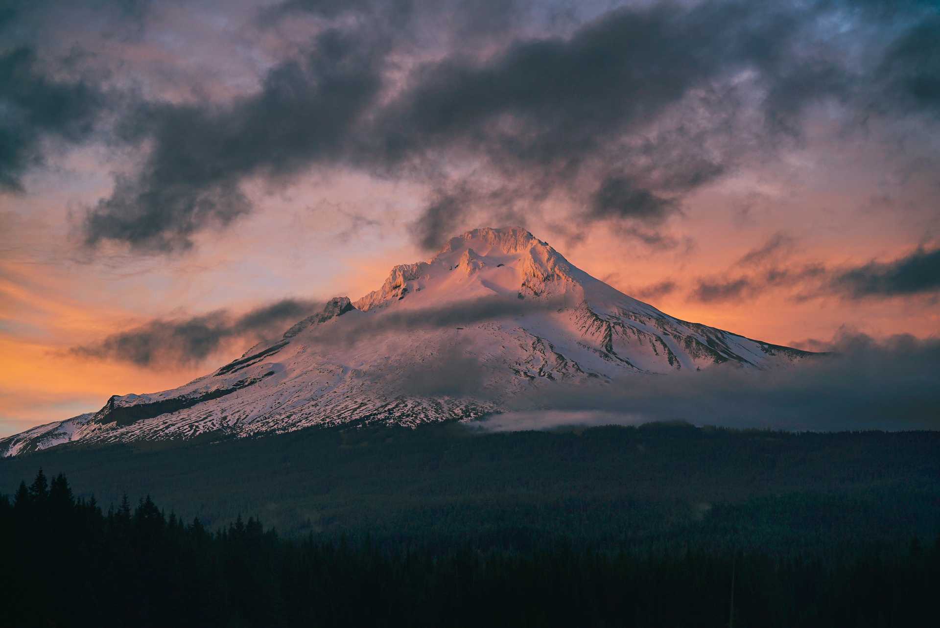 Snow Capped Mountain Under Gray Clouds.'